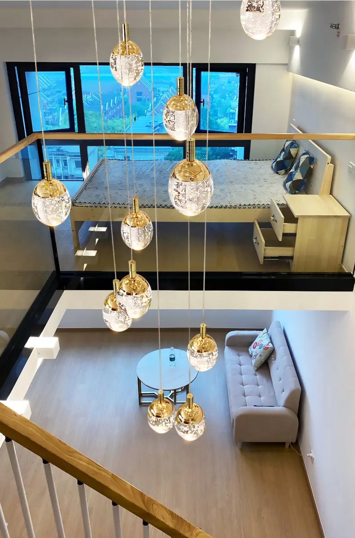 Anjelyn Ebrahim Gold Staircase Chandelier