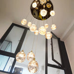 Anjelyn Ebrahim Gold Staircase Chandelier