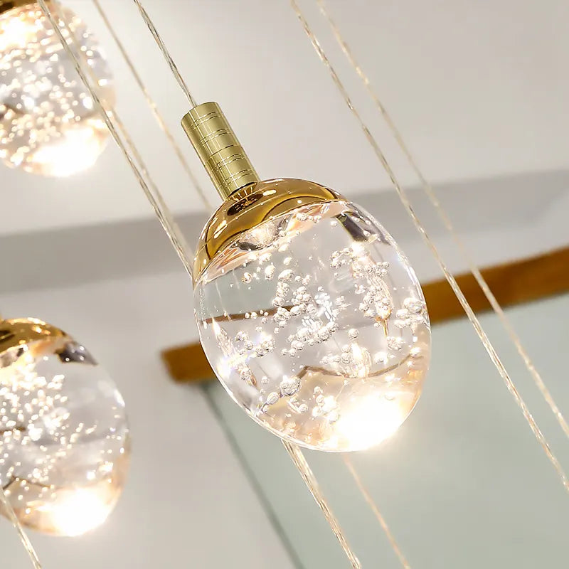 Anjelyn Ebrahim Gold Staircase Chandelier