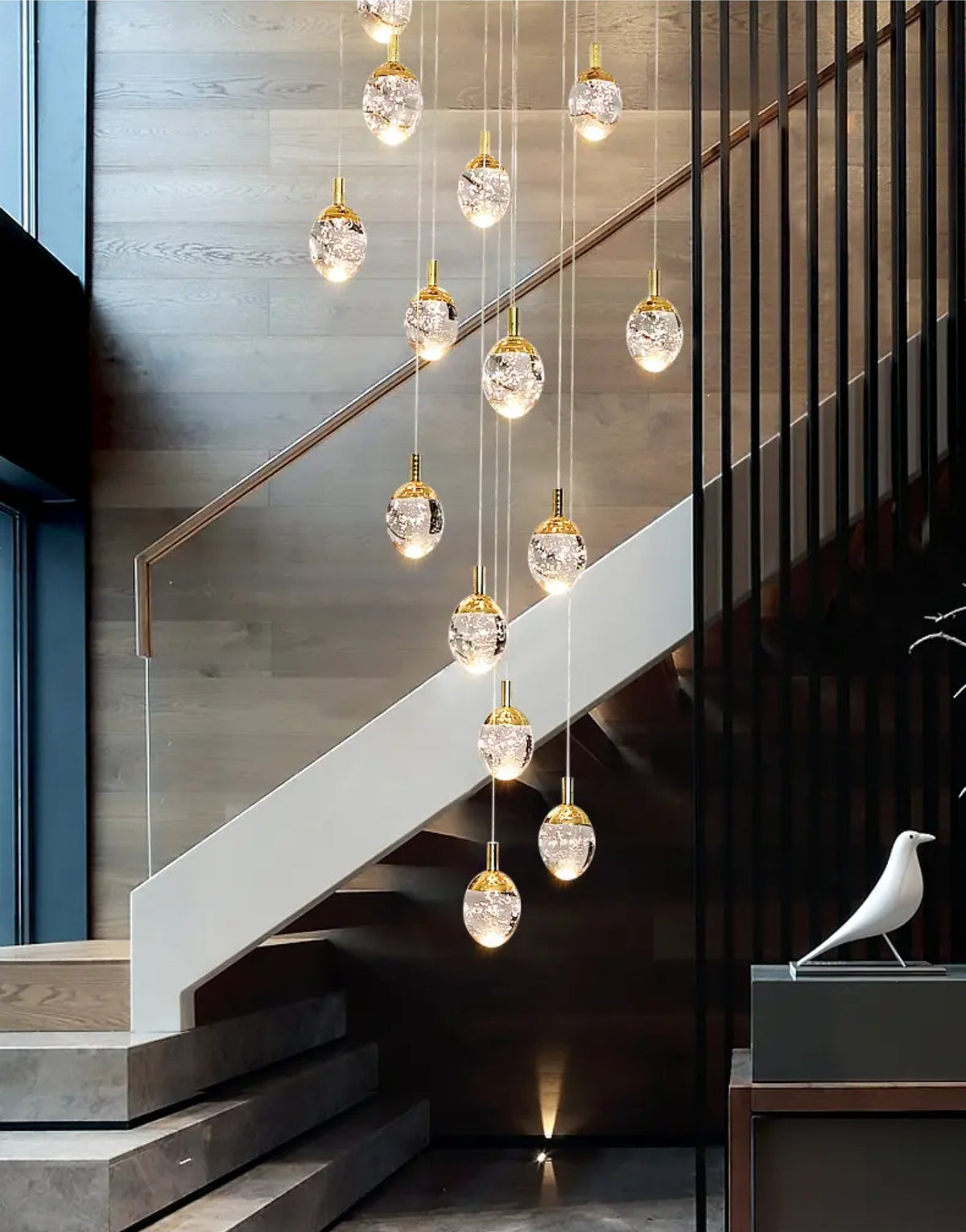 Anjelyn Ebrahim Gold Staircase Chandelier