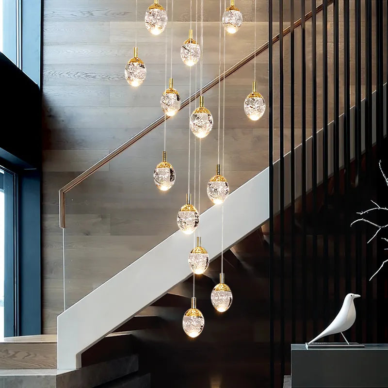 Anjelyn Ebrahim Gold Staircase Chandelier