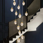 Anjelyn Ebrahim Gold Staircase Chandelier