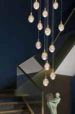 Anjelyn Ebrahim Gold Staircase Chandelier