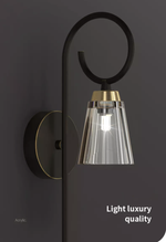 Daguiar Wall Light: Gold/Black - Reflect Lighting
